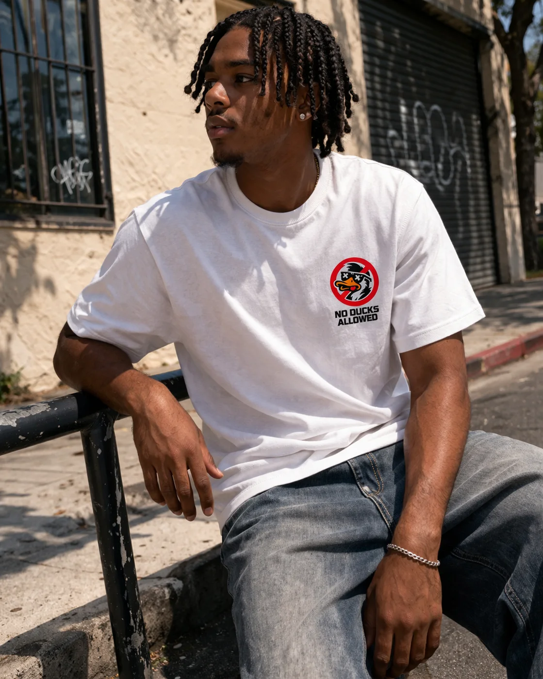 Model wearing the No Ducks Allowed logo tee